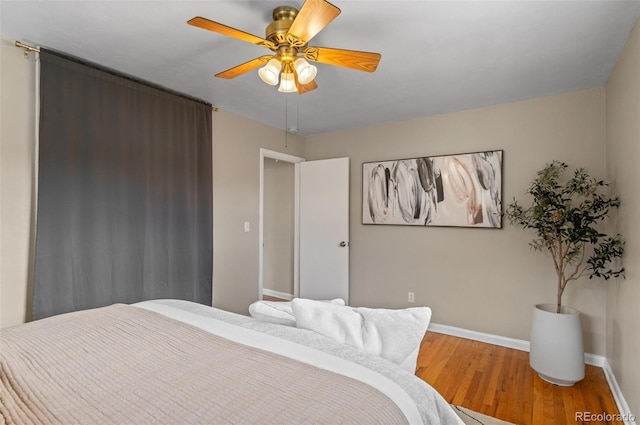 2248 Lima St, Aurora, CO 80010 - bedroom with wood finished floors and ceiling fan