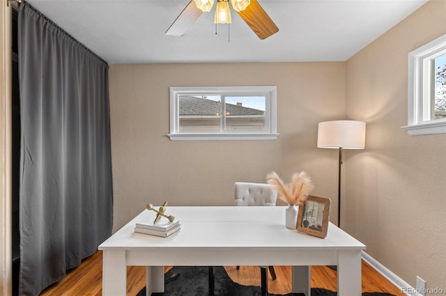2248 Lima St, Aurora, CO 80010 - office area with plenty of natural light, wood finished floors, and a ceiling fan