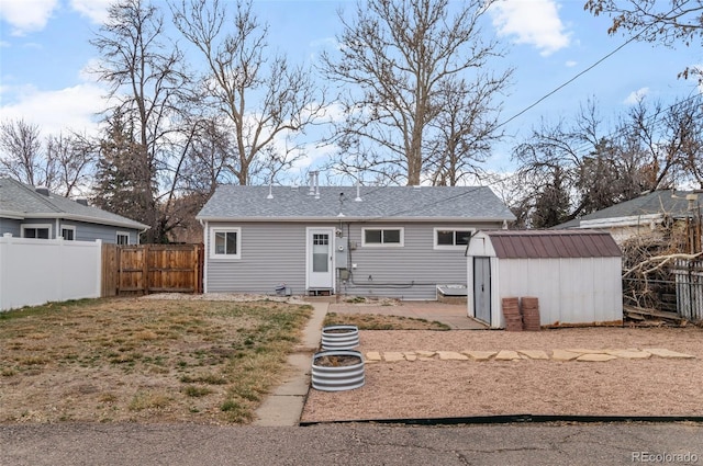 2248 Lima St, Aurora, CO 80010 - rear view of property with a storage unit