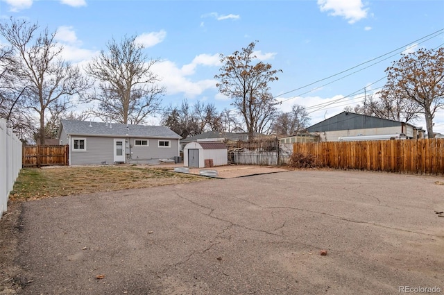 2248 Lima St, Aurora, CO 80010 - back of property with a storage shed and a fenced backyard