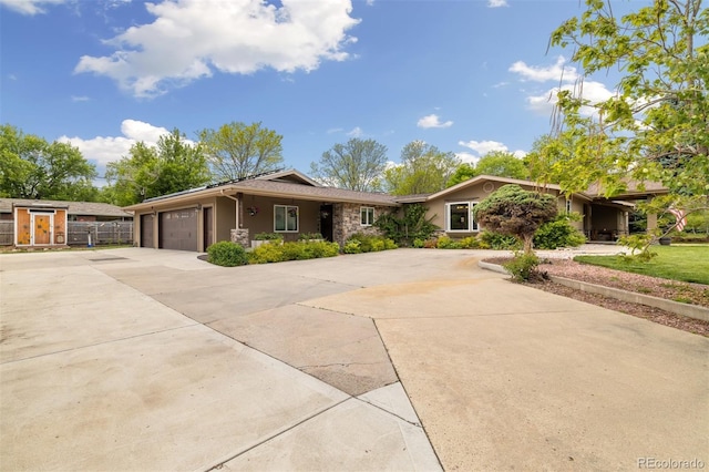 10380 W Warren Ave, Lakewood, CO 80227 - ranch-style house with driveway, a garage, and stucco siding