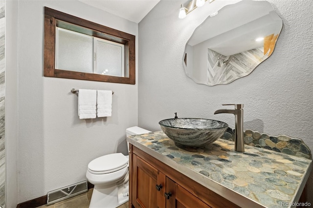 10380 W Warren Ave, Lakewood, CO 80227 - bathroom with vanity and toilet