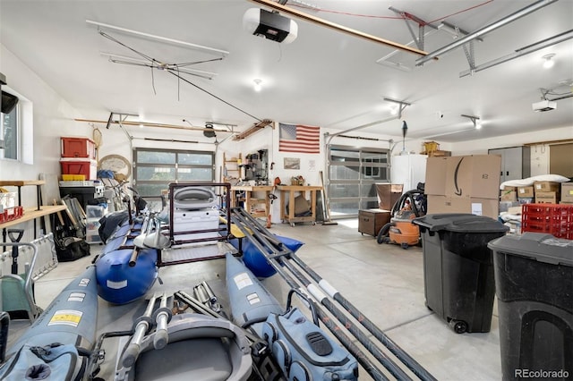 10380 W Warren Ave, Lakewood, CO 80227 - garage with fridge and a garage door opener
