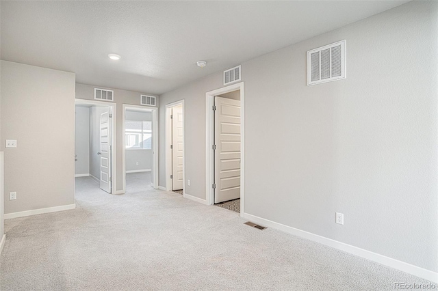 interior space featuring light colored carpet