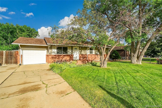 1030 Kohl St, Broomfield, CO 80020 - view of front of house featuring driveway, brick siding, and an attached garage