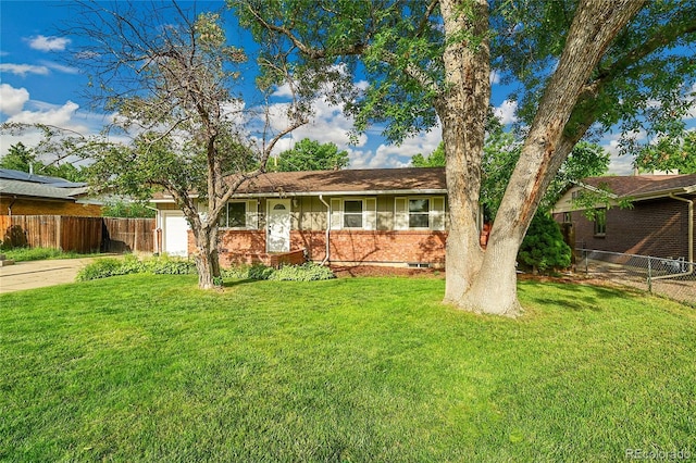1030 Kohl St, Broomfield, CO 80020 - single story home featuring a garage, brick siding, and concrete driveway