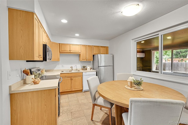 1030 Kohl St, Broomfield, CO 80020 - kitchen featuring freestanding refrigerator, electric range, white dishwasher, light countertops, and recessed lighting