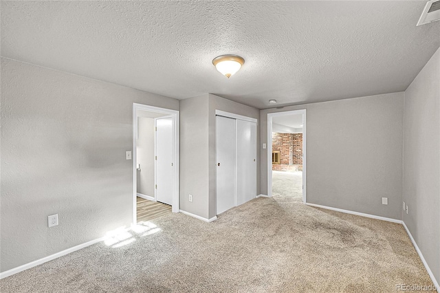 1030 Kohl St, Broomfield, CO 80020 - unfurnished bedroom featuring carpet floors, a closet, and a textured ceiling