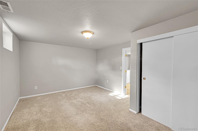 1030 Kohl St, Broomfield, CO 80020 - unfurnished bedroom featuring carpet floors, a closet, and a textured ceiling
