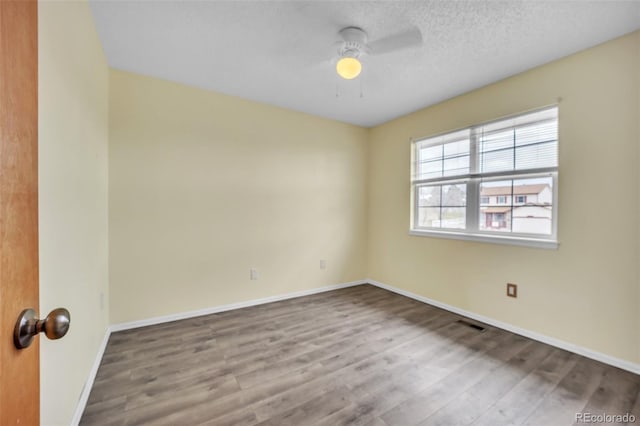 11640 Cranston Dr, Peyton, CO 80831 - spare room featuring baseboards, ceiling fan, and wood finished floors