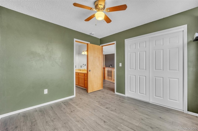 11640 Cranston Dr, Peyton, CO 80831 - unfurnished bedroom with a closet, light wood-type flooring, and baseboards