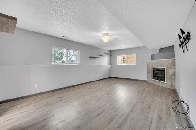 11640 Cranston Dr, Peyton, CO 80831 - unfurnished living room featuring visible vents, a textured ceiling, and wood finished floors