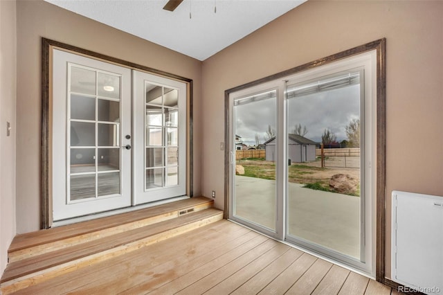 11640 Cranston Dr, Peyton, CO 80831 - doorway to outside featuring ceiling fan, light wood-type flooring, and french doors