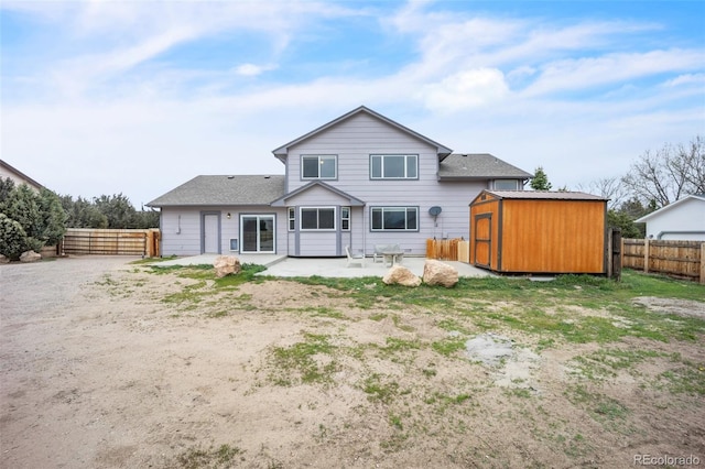 11640 Cranston Dr, Peyton, CO 80831 - back of house with a patio area, an outdoor structure, a fenced backyard, and a storage unit