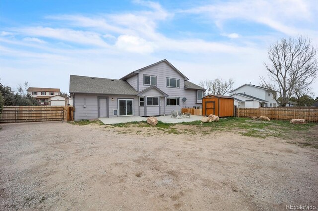 11640 Cranston Dr, Peyton, CO 80831 - rear view of house with a patio, a fenced backyard, an outbuilding, and a shed