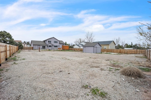 11640 Cranston Dr, Peyton, CO 80831 - view of yard with an outbuilding, a fenced backyard, and a storage unit