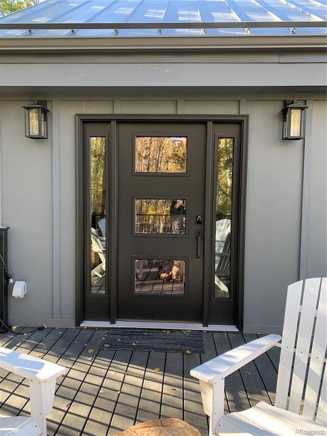 47 Lumberjack Rd, Fairplay, CO 80440 - view of exterior entry featuring stucco siding and metal roof