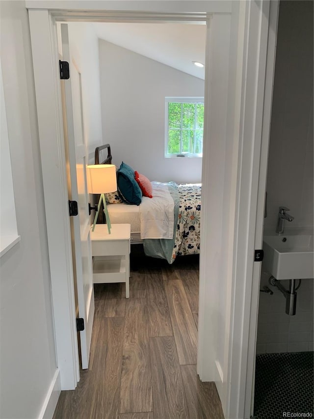 47 Lumberjack Rd, Fairplay, CO 80440 - bedroom with dark wood-style flooring, a sink, and vaulted ceiling