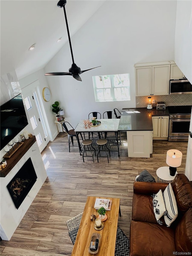 47 Lumberjack Rd, Fairplay, CO 80440 - living room featuring vaulted ceiling, light wood-type flooring, and a ceiling fan