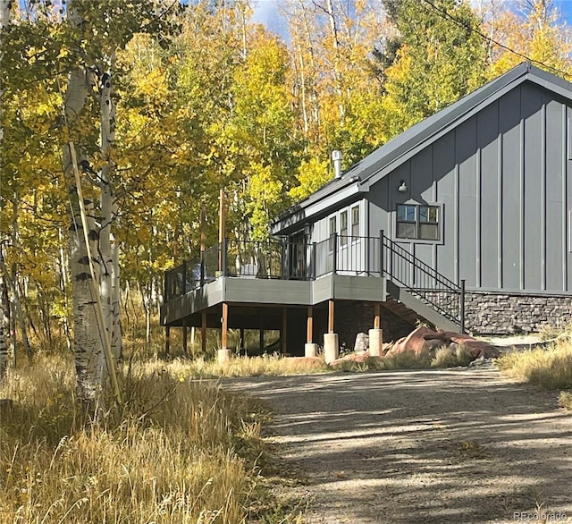 47 Lumberjack Rd, Fairplay, CO 80440 - view of home's exterior featuring board and batten siding, a deck, and stone siding