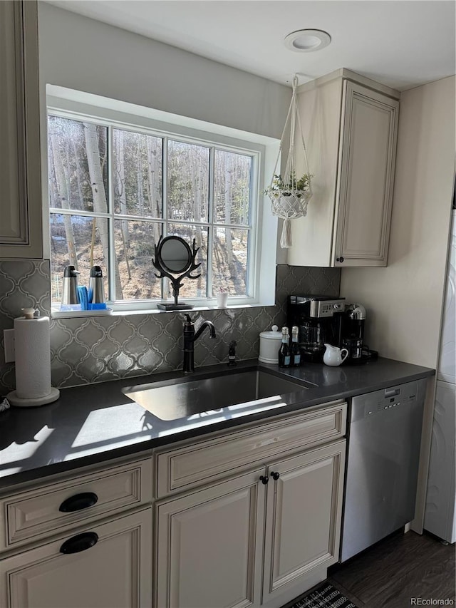 47 Lumberjack Rd, Fairplay, CO 80440 - kitchen featuring dishwasher, dark countertops, a sink, and tasteful backsplash