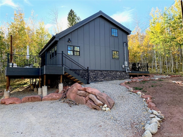47 Lumberjack Rd, Fairplay, CO 80440 - view of home's exterior with board and batten siding, a deck, and stairway