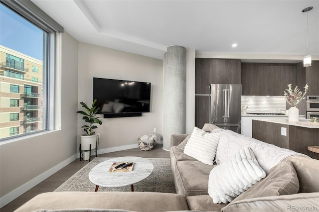 living room featuring hardwood / wood-style flooring and a wealth of natural light