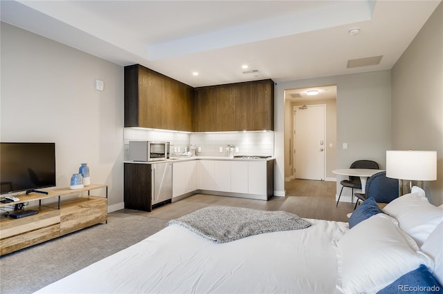 bedroom with light wood-type flooring