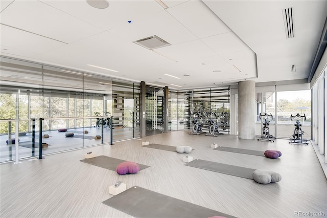 exercise room with floor to ceiling windows