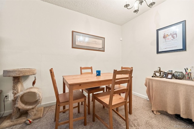 carpeted dining area featuring a textured ceiling