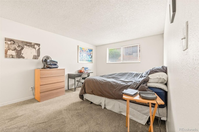 carpeted bedroom featuring a textured ceiling