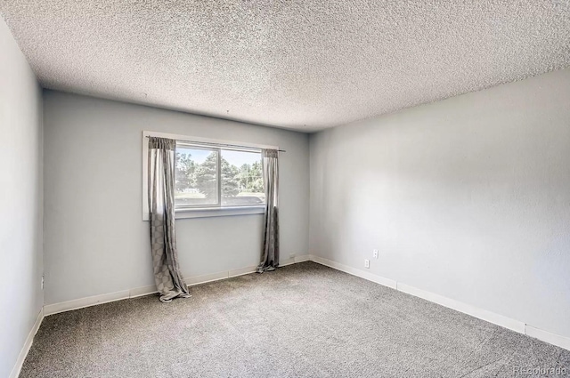 141 Mcclure Ave, Firestone, CO 80520 - empty room with carpet, a textured ceiling, and baseboards