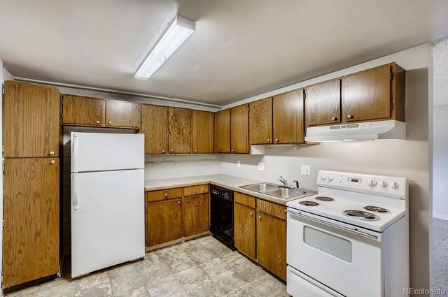 141 Mcclure Ave, Firestone, CO 80520 - kitchen featuring white appliances, under cabinet range hood, a sink, brown cabinets, and light countertops