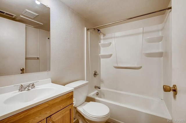 141 Mcclure Ave, Firestone, CO 80520 - full bath with a textured wall, toilet, vanity, and  shower combination