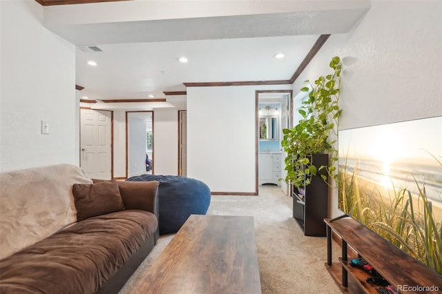 living room featuring crown molding, recessed lighting, visible vents, and light carpet