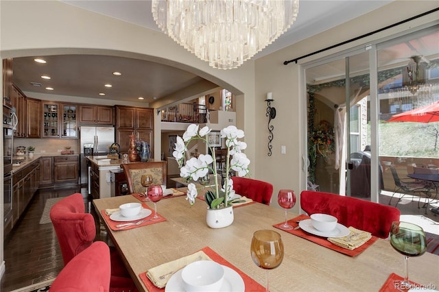 9546 Firenze Way, Highlands Ranch, CO 80126 - dining space featuring arched walkways and recessed lighting