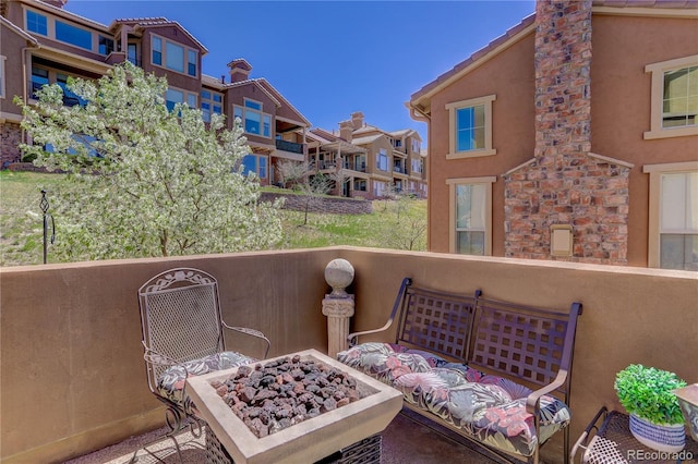 9546 Firenze Way, Highlands Ranch, CO 80126 - balcony with an outdoor fire pit and a residential view