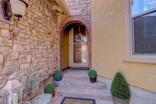 9546 Firenze Way, Highlands Ranch, CO 80126 - view of exterior entry with stone siding and stucco siding