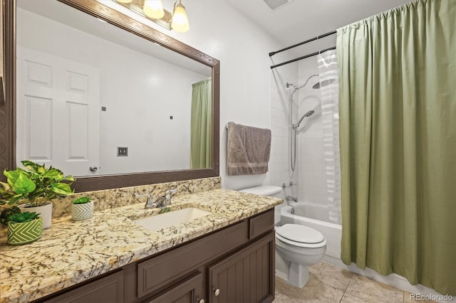 bathroom featuring vanity, shower / tub combo, tile patterned floors, and toilet
