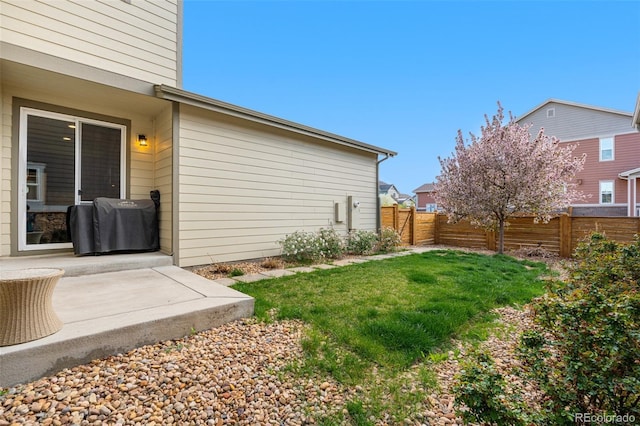 view of yard with a patio and fence