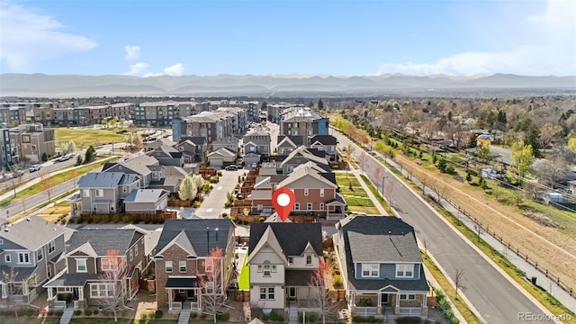 drone / aerial view featuring a mountain view and a residential view