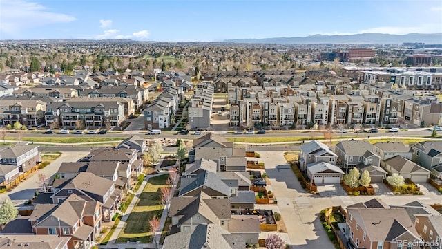birds eye view of property with a mountain view and a residential view
