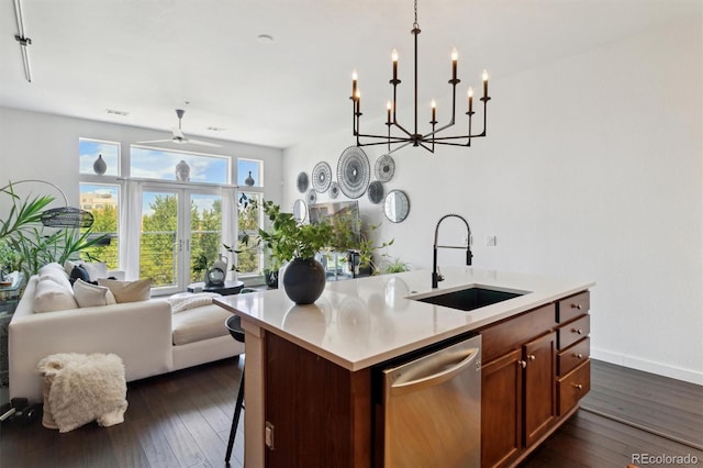 7240 W Custer Ave Unit 303, Lakewood, CO 80226 - kitchen with a sink, open floor plan, stainless steel dishwasher, a center island with sink, and dark wood-style floors