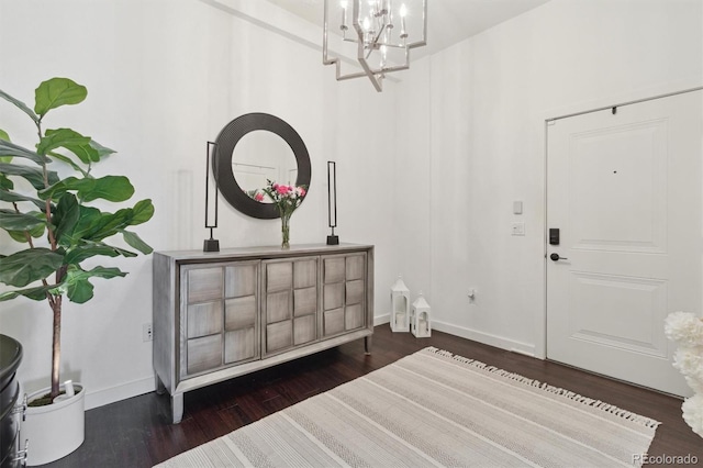 7240 W Custer Ave Unit 303, Lakewood, CO 80226 - entryway featuring dark wood finished floors, a chandelier, and baseboards