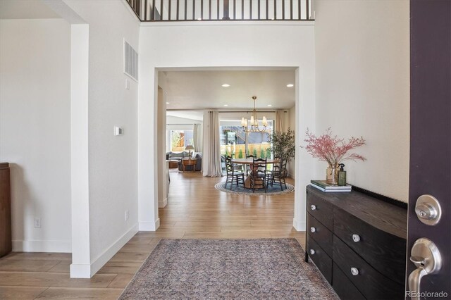 14423 Shasta Daisy Ln, Parker, CO 80134 - corridor featuring light wood-style flooring, a chandelier, and recessed lighting