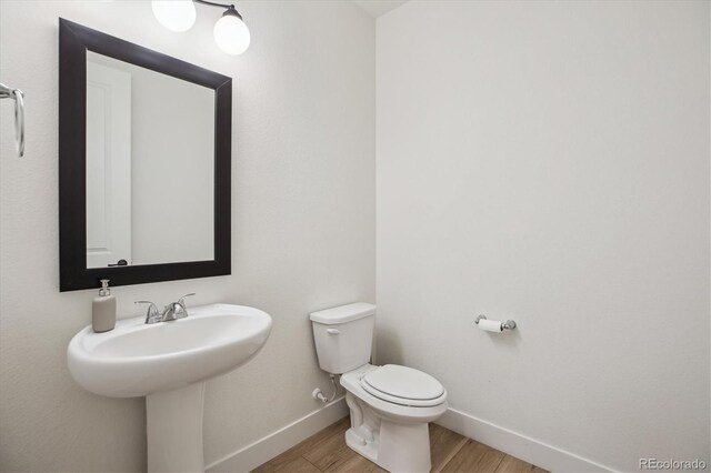 14423 Shasta Daisy Ln, Parker, CO 80134 - half bath featuring baseboards and wood finished floors