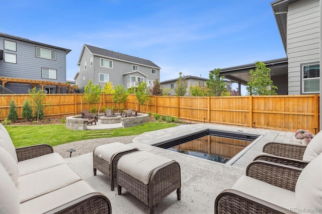 14423 Shasta Daisy Ln, Parker, CO 80134 - fenced backyard featuring an outdoor living space with a fire pit and a patio area