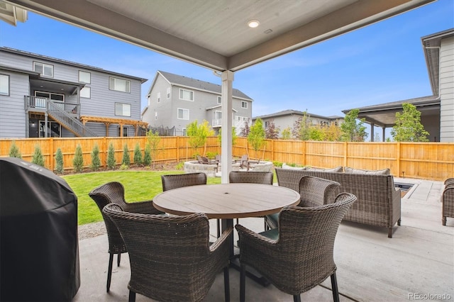 14423 Shasta Daisy Ln, Parker, CO 80134 - fenced backyard with a patio area, a grill, a residential view, and outdoor dining area