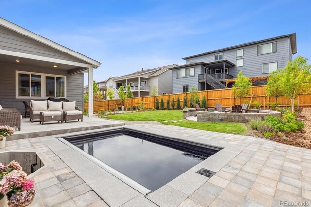 14423 Shasta Daisy Ln, Parker, CO 80134 - view of pool featuring an outdoor living space with a fire pit, a patio, and a fenced backyard
