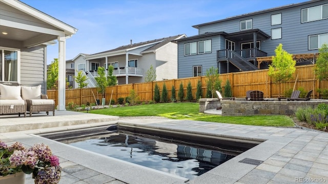 14423 Shasta Daisy Ln, Parker, CO 80134 - view of pool featuring an outdoor fire pit, a fenced backyard, a patio area, and a residential view